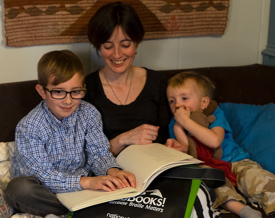 Family Reading Braille Together 
